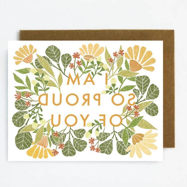 Outside of card reads "I am so proud of you" surrounded by a flower and leaves design